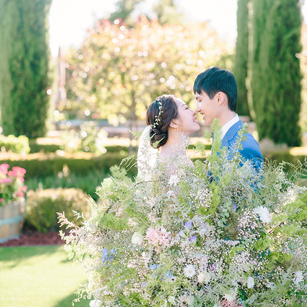 Regale-winery-couple-with-flower-umbrella